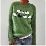 Žalias megztinis su avyčių motyvu